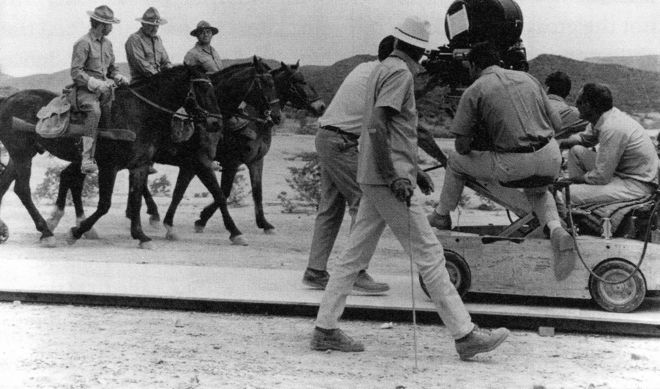 IMAGE: Sam Peckinpah and crew direct the opening scene of The Wild Bunch