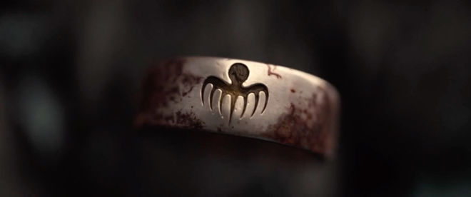 IMAGE: Still – SPECTRE logo on ring